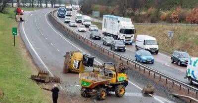 Digger falls off lorry after vehicle hit bridge with busy Scots road closed - www.dailyrecord.co.uk - Scotland - Beyond