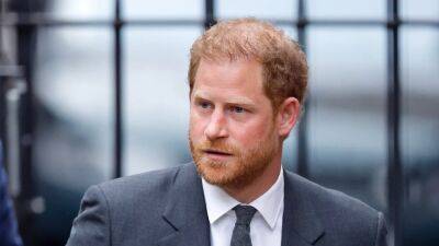 Prince Harry Accuses Royal Family of 'Withholding' Information From Him About Phone Hacking - www.etonline.com - London