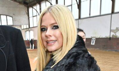 Newly single Avril Lavigne puts on show-stopping display in knee-high boots - hellomagazine.com - Paris