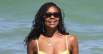 Gabrielle Union Shows Off Her Abs in Yellow Bikini as She Locks Lips With Husband Dwyane Wade: Photos - www.usmagazine.com - Miami - Chicago - county Cavalier - county Cleveland