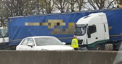 Chaos as M62 closed for hours after lorry crash causes spillage with one taken to hospital - www.manchestereveningnews.co.uk - Manchester