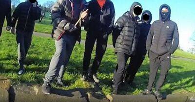 Gang of hooded youths surround police, block them from car and throw sticks at them - www.dailyrecord.co.uk