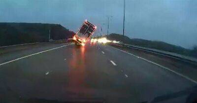 Dashcam footage captures terrifying moment lorry is blown over on M62 - www.manchestereveningnews.co.uk - Manchester