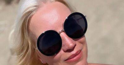 Swimsuit-clad Denise Van Outen living her best life with a massage on the beach - www.ok.co.uk - Spain
