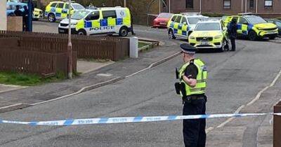 Lockdown of Scots street ends as cops arrest man after armed cops called in and homes evacuated - www.dailyrecord.co.uk - Scotland