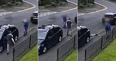 'Do you want this over your head?': Horrifying moment man is whacked with 'paving slab' just yards from a school gate - www.manchestereveningnews.co.uk - Manchester