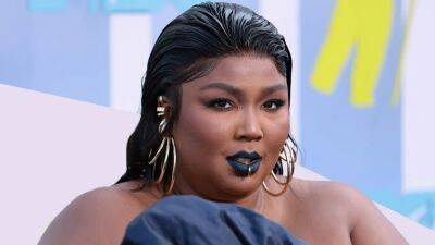 Lizzo Says She 'Is the Beauty Standard,’ Calls out Discourse Around Her Body - www.glamour.com
