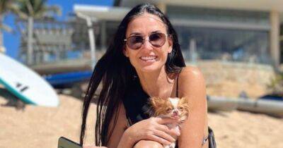 Demi Moore, 60, shows off age-defying figure in bikini during beach day with her dog - www.ok.co.uk