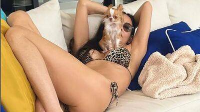 Demi Moore enjoys beach day in animal print string bikini, poses with her Chihuahua - www.foxnews.com - county Page