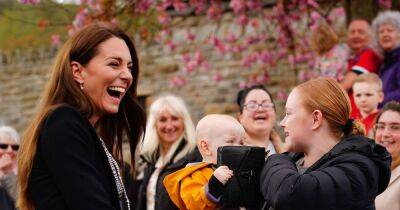 Kate Middleton's £675 handbag grabbed by baby in adorable moment during Aberfan visit - www.ok.co.uk