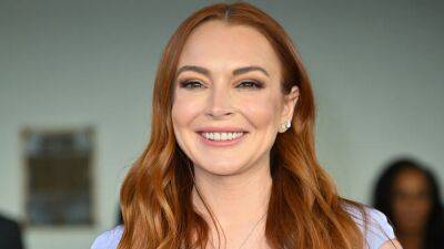 Lindsay Lohan Is Absolutely Glowing as She Cradles Her Baby Bump in New Pics - www.glamour.com
