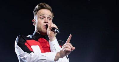 Olly Murs says he 'regrets' not being there for Croline Flack as he cries live on stage - www.ok.co.uk - Britain - London