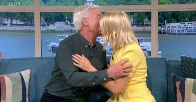 Holly Willoughby and Phil Schofield leave fans 'cringing' with kiss amid 'feud' - www.ok.co.uk