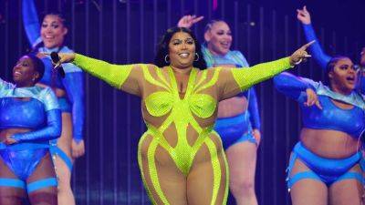 Lizzo Shares Candid Message About Losing Weight Without 'Trying to Escape Fatness' - www.etonline.com