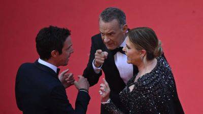 Rita Wilson Explained What Was Really Going on in Those Viral Pics of Her and Tom Hanks at Cannes - www.glamour.com - city Asteroid