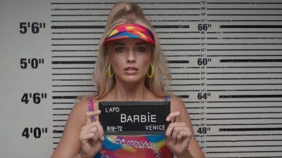 'Barbie' Trailer: Margot Robbie and Ryan Gosling Venture to the Real World -- And Get Arrested! - www.etonline.com