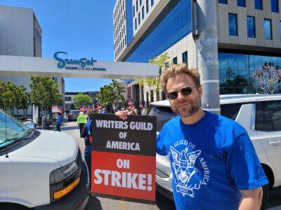 Negotiating Committee Member Adam Conover On Battle Over AI & Preservation Of The Writers Room, AMPTP Using DGA To “Undercut” WGA - deadline.com