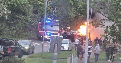 Shocking moment car bursts into flames with two rushed to hospital - www.manchestereveningnews.co.uk - Manchester