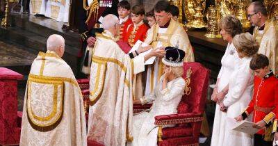 Queen Camilla Fixes Crown, Smiles As She Is Blessed and Anointed Alongside King Charles III During Coronation - www.usmagazine.com