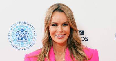 Amanda Holden pairs neon pink suit with daring exposed bra for Coronation concert - www.ok.co.uk