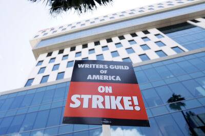 WGA Strike: Studios Move In To Suspend TV Overall Deals - deadline.com