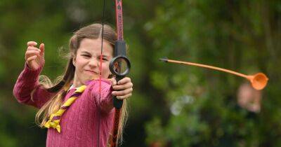 Princess Charlotte shows her brothers how it's done as she shoots arrows in cut off shorts - www.ok.co.uk