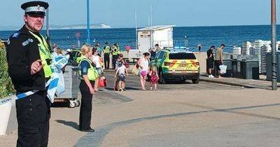 Girl, 12, and teen boy die after getting into difficulty at beach as man arrested - www.dailyrecord.co.uk