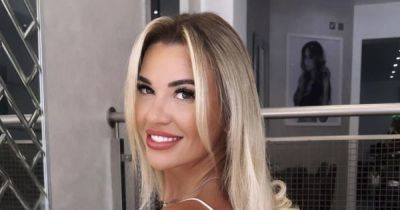 Christine McGuinness shows off bronzed legs in Barbie-pink look after declaring she has 'so much to smile about' - www.manchestereveningnews.co.uk - Beyond