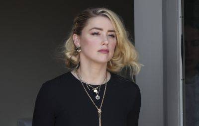 Amber Heard asks not to have “stones thrown” at her by the media - www.nme.com
