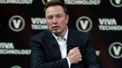 Elon Musk Reacts Amid Outrage Over 'Temporary' Daily Twitter Limitations - www.etonline.com