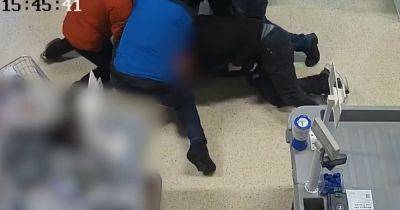 Moment gunman is arrested in Tesco after killing woman in Christmas Eve shooting - www.dailyrecord.co.uk - city Newtown