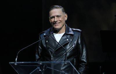 Watch Bryan Adams’ relaxed response after fan crashes stage to take microphone - www.nme.com - USA - Utah - county Bryan - city Salt Lake City