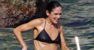 Jennifer Connelly for Goes Dip in the Sea on Vacation in Italy - www.justjared.com - Italy