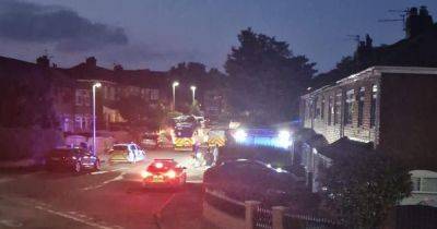 Residents hear 'arguing' and 'loud bangs' before fire outside house following 'disturbance' in street - www.manchestereveningnews.co.uk - Manchester
