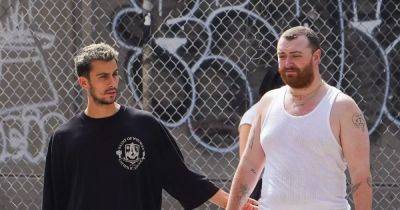 Sam Smith dons white skirt and matching tank top for NY stroll with rumoured boyfriend - www.ok.co.uk - New York