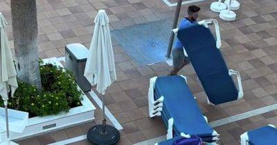 Holidaymakers filmed laying out their sun loungers at 6.30am...almost FOUR HOURS before pool opens - www.manchestereveningnews.co.uk