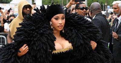 Cardi B’s Over-the-Top Haute Couture Fashion Week Outfits: Feather Coats, Headpieces and More - www.usmagazine.com