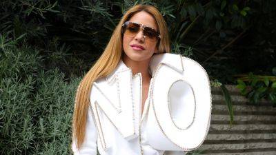 Shakira Wears a Giant 'NO' Jacket to Paris Fashion Week - www.etonline.com