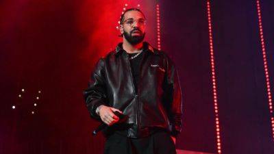 Drake Gets Hit With Cell Phone While Performing Opening Night of 'It's All a Blur' Tour - www.etonline.com - Chicago - state Idaho