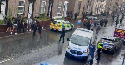 'Get off the street': Video shows police battle to control huge group of youths after house party 'got out of hand' - www.manchestereveningnews.co.uk - Manchester