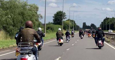 Moment hundreds of scooters take over East Lancs Road in procession - www.manchestereveningnews.co.uk - Manchester