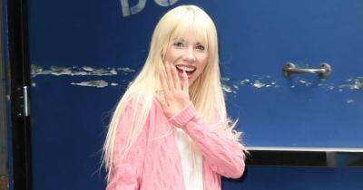 Carly Rae Jepsen Is All Smiles in a Bright Pink Cardigan — Get the Look - www.usmagazine.com - New York
