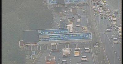 Police detain person on M60 hard shoulder after they 'crossed motorway' - www.manchestereveningnews.co.uk