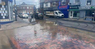 Water main leak causes flooding chaos on high street - www.manchestereveningnews.co.uk - Manchester - county Denton