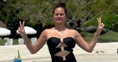Chrissy Teigen stuns in swimsuit after welcoming 'kind of twins' - www.ok.co.uk - Mexico