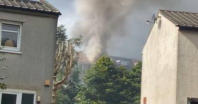 Emergency services race to house fire in Scots town as smoke billows from home - www.dailyrecord.co.uk - Scotland - Beyond