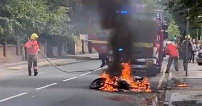 Moment motorbike goes up in flames after 'commotion' on busy road - www.manchestereveningnews.co.uk - Manchester