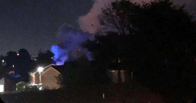 Woman jumped from upstairs window as fire tore through home - www.manchestereveningnews.co.uk - Manchester