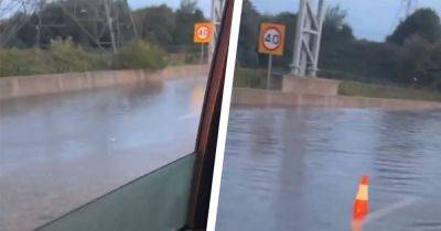 Crazy footage shows drivers battling flooded motorway as roads submerged in water - www.manchestereveningnews.co.uk - Manchester