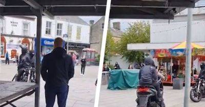 'F****** come on then!'....Moment armed bikers terrorise shoppers in busy market - www.manchestereveningnews.co.uk - Manchester - county Hyde